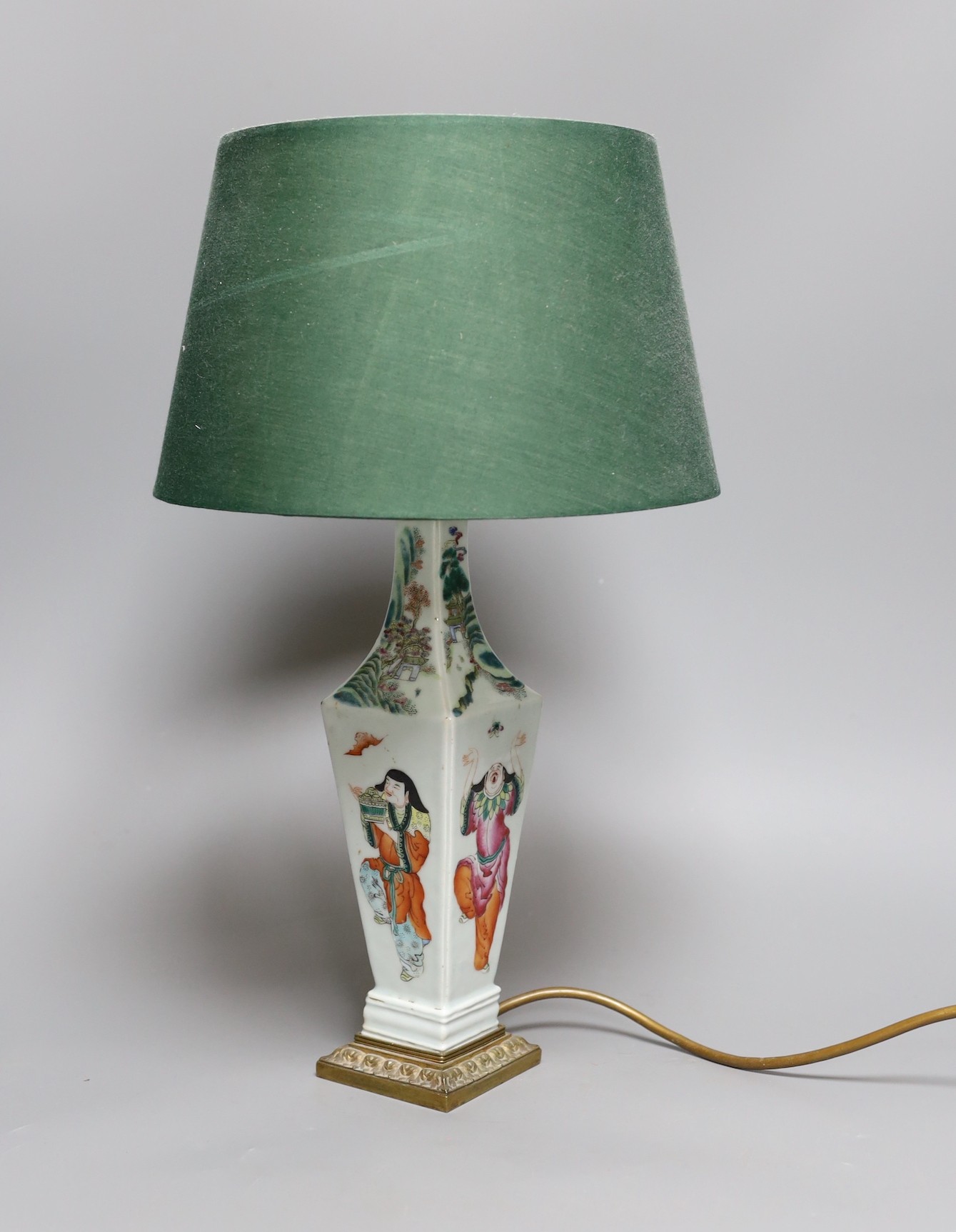 A Chinese famille rose ‘Liu Hai’ vase, late 19th century, with gilt mounts, drilled and converted to a lamp, 28 cms high